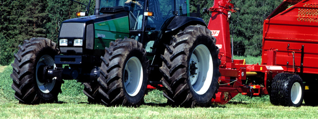 green tractor with trees