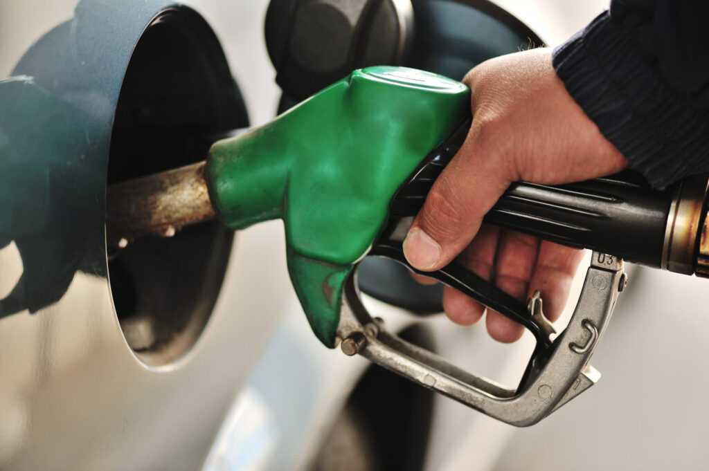 man filling up car after saving fuel with economy remapping
